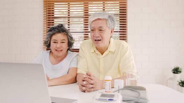 Elderly couple using a webcam