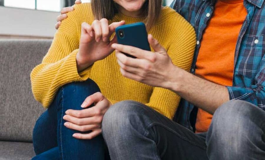 Couple using phone